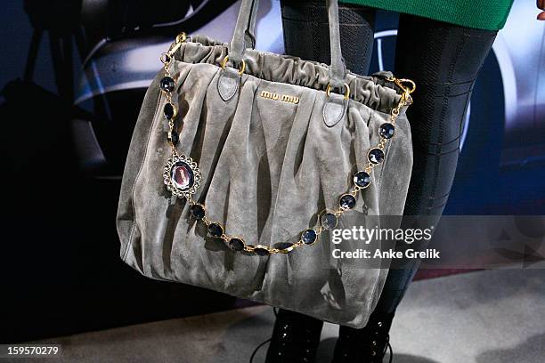 Fashion Week guest with a MiuMiu bag, Mercedes-Benz Fashion Week Autumn/Winter 2013/14 on January 16, 2013 in Berlin, Germany.