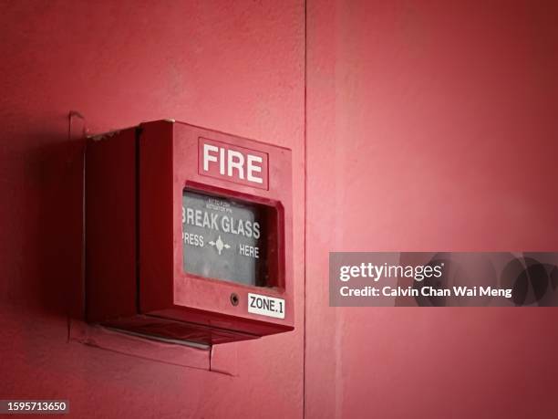 fire break glass panel - emergencies and disasters stock-fotos und bilder