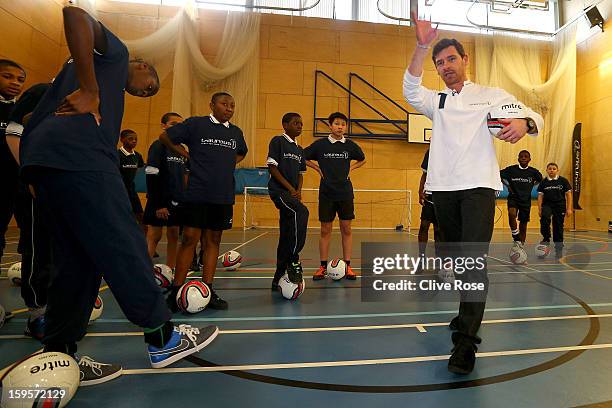 Andre Villas Boas gives football coaching to local school children during the Laureus Urban Research report launch on January 16, 2013 in London,...