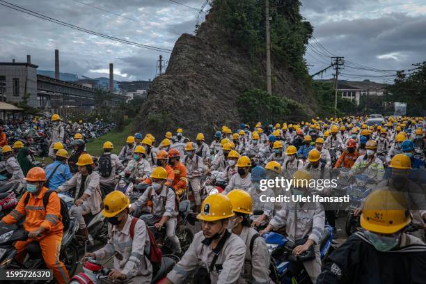 Employees in traffic during the working shift change near Indonesia Morowali Industrial Park , that consists of around 77,000 local workers and...