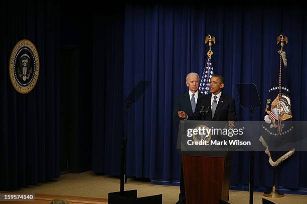 President Barack Obama , is flanked by Vice President Joe Biden before signing an executive order designed to tackle gun control, on January 16, 2012...