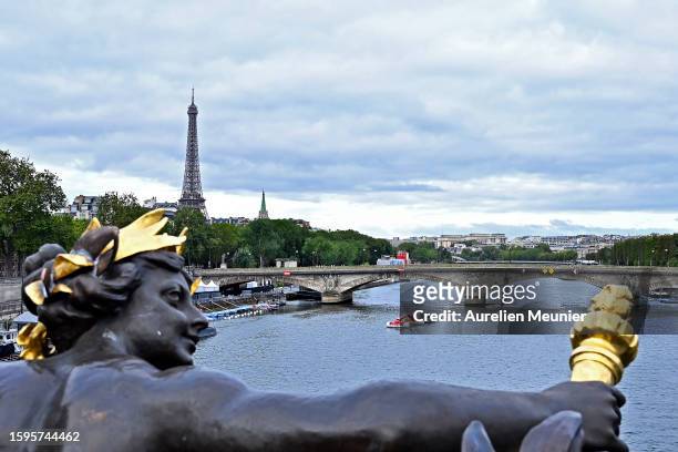 Boat is pulling out the starting line in front of The Eiffel Tower after the cancelation of the Open Water Swimming World Cup at River Seine on...