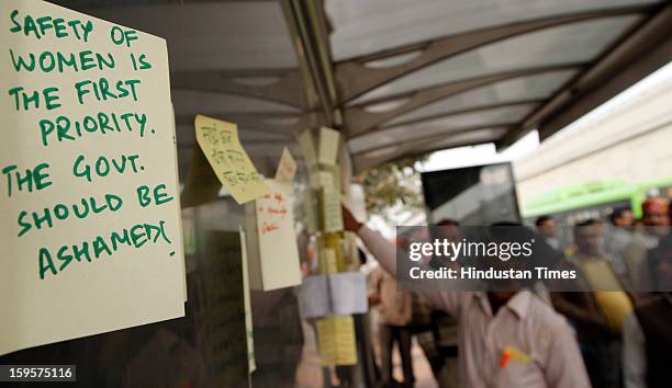 People writing their sentiments for the victim of the gang rape on bus stand at Munirka on January 16, 2013 in New Delhi, India. It is the same spot...