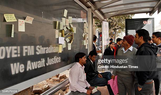 People writing their sentiments for the victim of the gang rape on bus stand at Munirka on January 16, 2013 in New Delhi, India. It is the same spot...