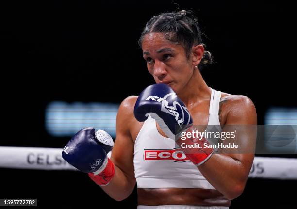 Amanda Serrano faces off against Heather Hardy during the third round of their fight at the American Airlines Center on August 05, 2023 in Dallas,...