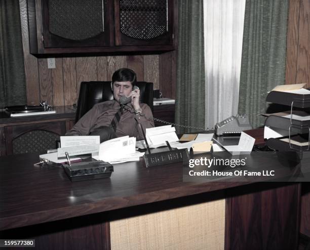 Songwriter and producer Rick Hall poses for a portrait in his office at FAME Studios in 1968 in Muscle Shoals, Alabama.
