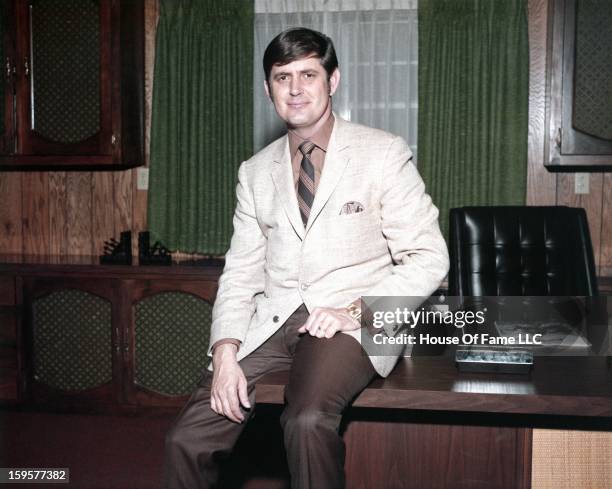 Songwriter and producer Rick Hall poses for a portrait in his office at FAME Studios in 1968 in Muscle Shoals, Alabama.