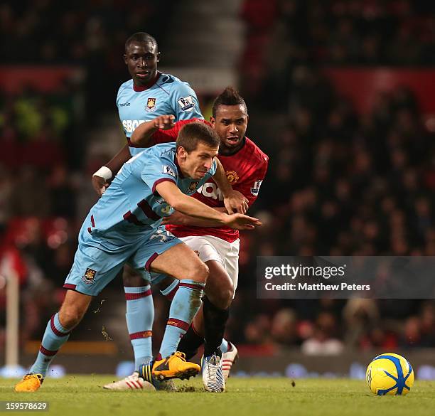 Anderson of Manchester United in action with Matt Taylor of West Ham United during the FA Cup Third Round Replay between Manchester United and West...