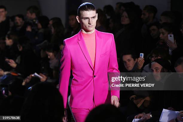 Model displays a creation by Japanese-Italian designer Nicola Formichetti for the label Mugler during the men's Fall-Winter 2013-2014 collection...