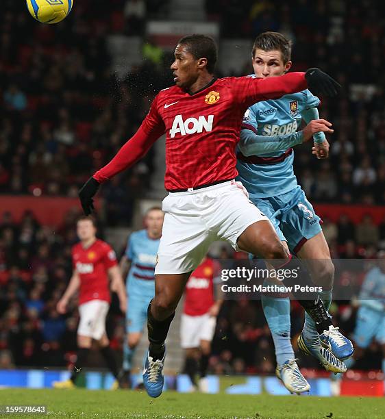 Antonio Valencia of Manchester United in action with Daniel Potts of West Ham United during the FA Cup Third Round Replay between Manchester United...