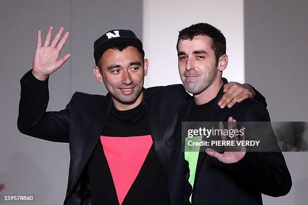 Japanese-Italian designer Nicola Formichetti and collection designer Sebastien Teigne for the label Mugler acknowledges the public following the...