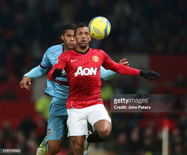 Nani of Manchester United in action with Jordan Spence of West Ham United during the FA Cup Third Round Replay match between Manchester United and...