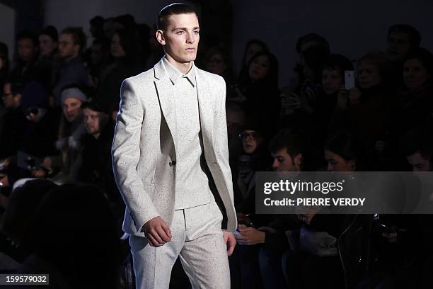 Model displays a creation by Japanese-Italian designer Nicola Formichetti for the label Mugler during the men's Fall-Winter 2013-2014 collection...