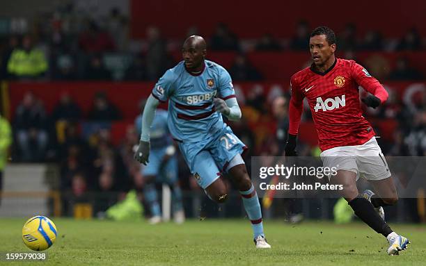 Nani of Manchester United in action with Alou Diarra of West Ham United during the FA Cup Third Round Replay match between Manchester United and West...