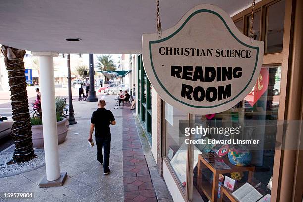 Man walks past a Christian Science Reading Room on Cleveland Street January 16, 2013 in Clearwater, Florida. Reading Rooms provide communities with...