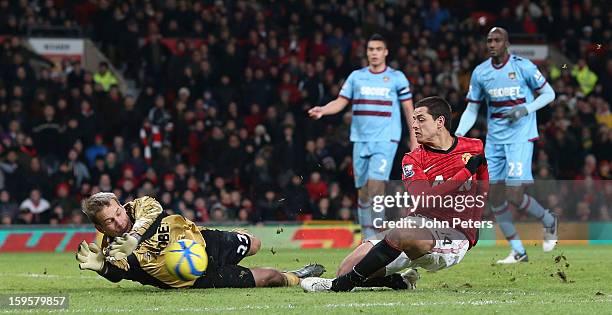 Javier "Chicharito" Hernandez of Manchester United in action with Jussi Jaaskelainen of West Ham United during the FA Cup Third Round Replay match...