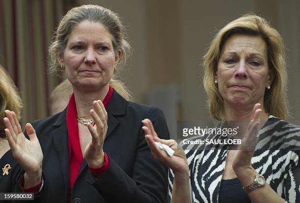 Abigail Spangler , Founder of Protest Easy Guns, and Martina Leinz, President of the Million Mom March, applaud during a meeting of the House...