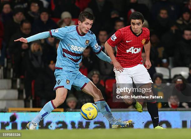 Rafael Da Silva of Manchester United in action with Daniel Potts of West Ham United during the FA Cup Third Round Replay between Manchester United...