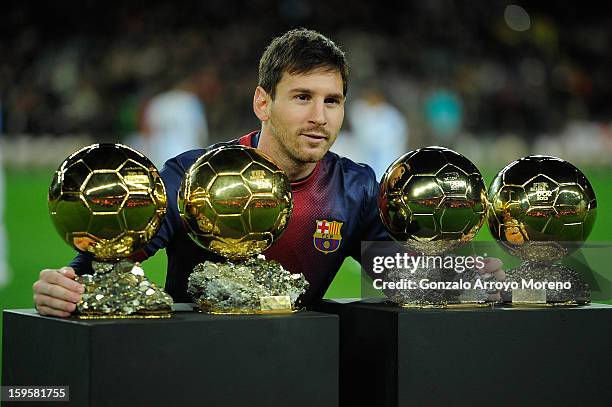 Leo Messi of Barcelona FC displays his four ballons d'or to the audience prior to the Copa del Rey Quarter Final match between Barcelona FC and...