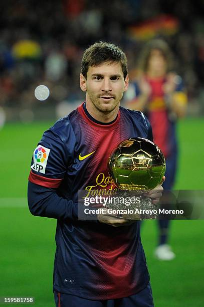 Leo Messi of Barcelona FC displays his 4th ballon d'or to the audience prior to the Copa del Rey Quarter Final match between Barcelona FC and Malaga...