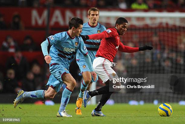 Danny Potts of West Ham United competes with Luis Antonio Valencia of Manchester United during the FA Cup with Budweiser Third Round Replay match...