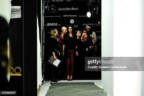 Model prepares backstage ahead of the Agne Kuzmickaite, Igrida Zabere, Kaetlin Kaljuvee Autumn/Winter 2013/14 fashion show during Mercedes-Benz...