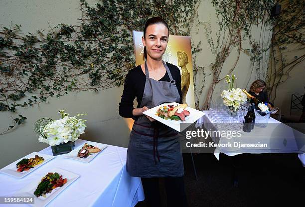 Lucques chef Suzanne Goin holds a vegan plate which she prepared and to be served at the 19th annual SAG Awards during food and wine tasting event at...