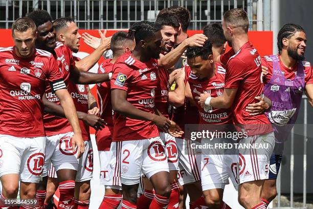 Brest's French defender Kenny Lala is congratulated by his teammates after he scored the second goal of his team during the French L1 football match...