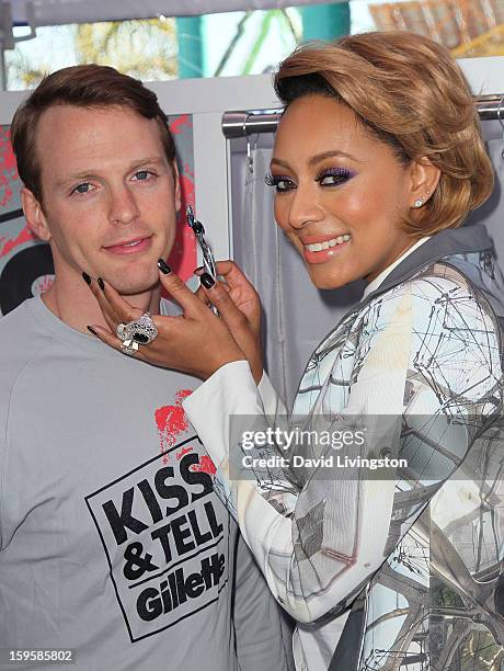 Singer Keri Hilson with model Daniel Hitchingham launch the Gillette "Kiss & Tell" Experiment on the Santa Monica Pier on January 16, 2013 in Santa...