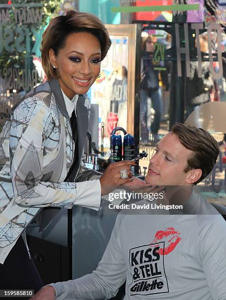 Singer Keri Hilson with model Daniel Hitchingham launch the Gillette "Kiss & Tell" Experiment on the Santa Monica Pier on January 16, 2013 in Santa...