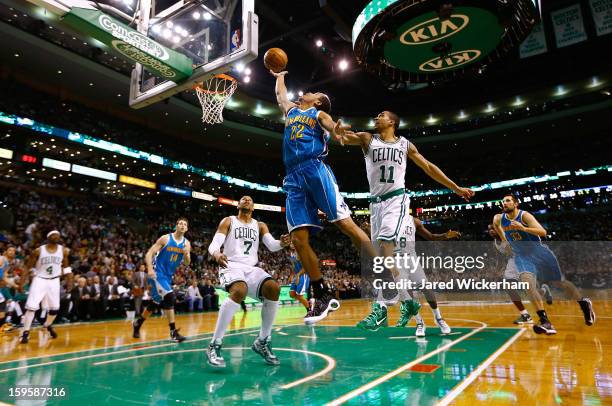 Brian Roberts of the New Orleans Hornets goes up for a layup in front of Courtney Lee of the Boston Celtics during the game on January 16, 2013 at TD...