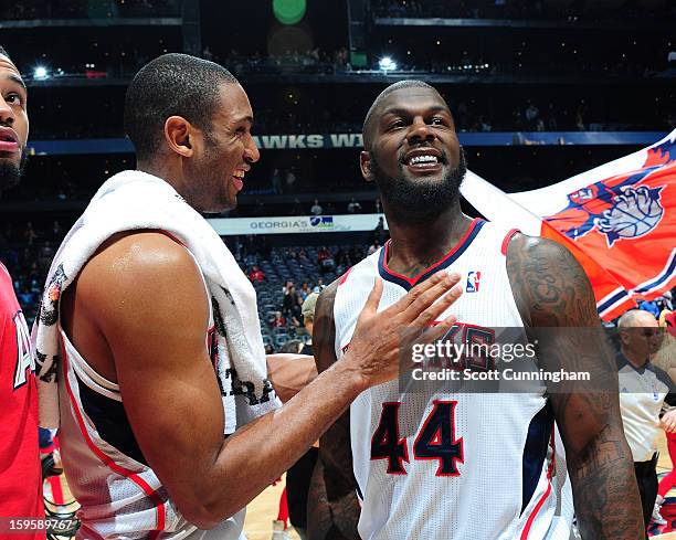 Al Horford and Ivan Johnson of the Atlanta Hawks smile after a victory against the Brooklyn Nets on January 16, 2013 at Philips Arena in Atlanta,...