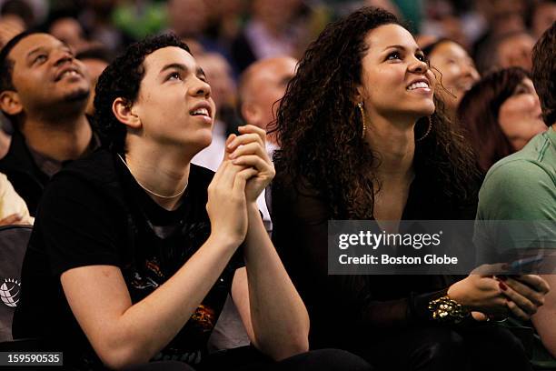 Children of Celtics coach Doc Rivers, Spencer Rivers, left, and Callie Rivers sat court side to watch their brother, Hornets guard Austin Rivers, as...