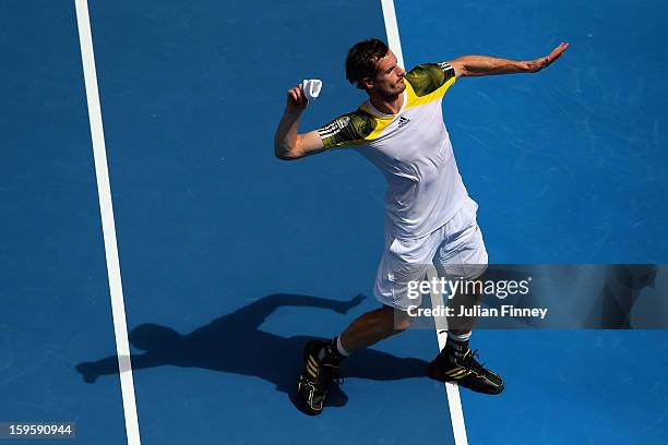 Andy Murray of Great Britain throws his wristband into the crowd after winning his second round match against Joao Sousa of Portugal during day four...