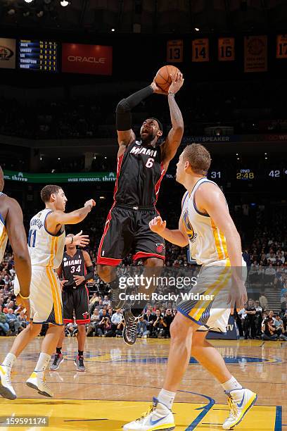 LeBron James of the Miami Heat makes a shot, passing the 20,000 point career milestone, during a game against the Golden State Warriors on January...