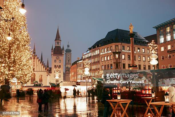 christmas market on marienplatz by new town hall - munich stock pictures, royalty-free photos & images
