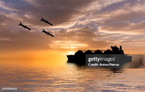 cruise missiles over lng carrier in the sea. - terrorism news stock pictures, royalty-free photos & images