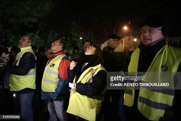 French automaker Peugeot-Citroen workers take part in a demonstration in front of the residence of Thierry Peugeot, the Chairman of Supervisory Board...