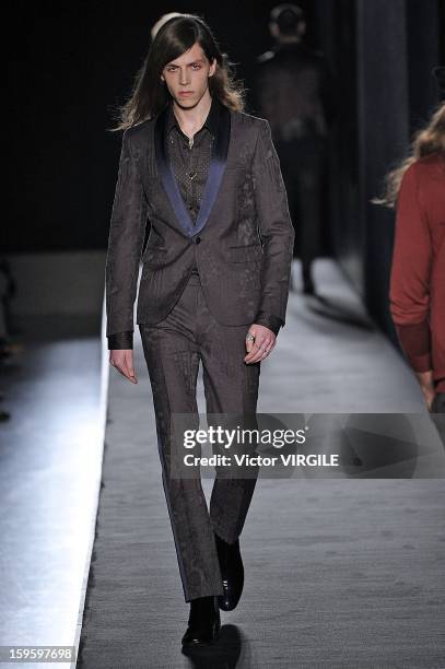 Model walks the runway during the Diesel Black Gold Ready to Wear Fall/Winter 2013-2014 show as part of Milan Fashion Week Menswear Autumn/Winter...