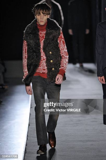 Model walks the runway during the Diesel Black Gold Ready to Wear Fall/Winter 2013-2014 show as part of Milan Fashion Week Menswear Autumn/Winter...