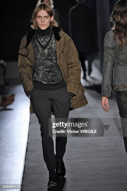 Model walks the runway during the Diesel Black Gold Ready to Wear Fall/Winter 2013-2014 show as part of Milan Fashion Week Menswear Autumn/Winter...