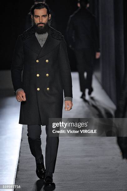 Model walks the runway during the Diesel Black Gold Ready to Wear Fall/Winter 2013-2014 show as part of Milan Fashion Week Menswear Autumn/Winter...