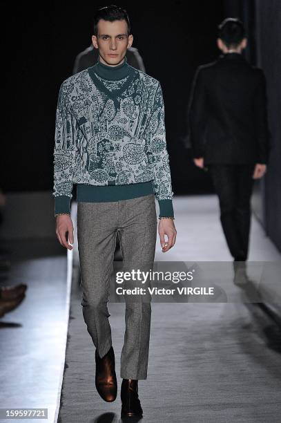 Model walks the runway during the Diesel Black Gold Ready to Wear Fall/Winter 2013-2014 show as part of Milan Fashion Week Menswear Autumn/Winter...