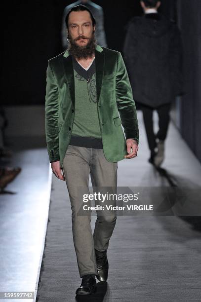 Model walks the runway during the Diesel Black Gold Ready to Wear Fall/Winter 2013-2014 show as part of Milan Fashion Week Menswear Autumn/Winter...