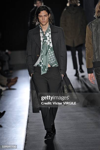 Model walks the runway during the Diesel Black Gold Ready to Wear Fall/Winter 2013-2014 show as part of Milan Fashion Week Menswear Autumn/Winter...