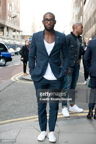 Tinnie Tempah rapper wearing a Burberry suit on day 2 of London Mens Fashion Week Autumn/Winter 2013, on January 08, 2013 in London, England.