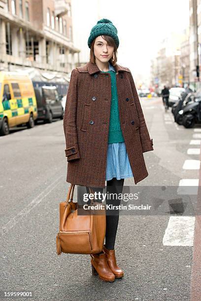 Ella Catliff blogger wearing a whistles coat and jumper, Topshop dress and hat, Anya Hindmarch bag and Massimo Dutti shoes on day 2 of London Mens...