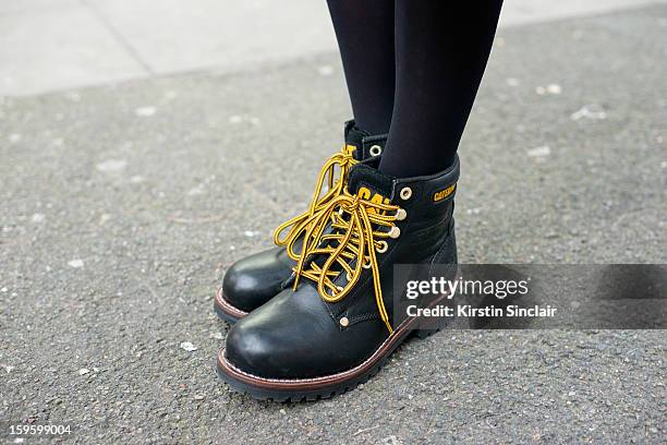 Alex Craven Fashion Pr wearing Caterpilar boots on day 2 of London Mens Fashion Week Autumn/Winter 2013, on January 08, 2013 in London, England.