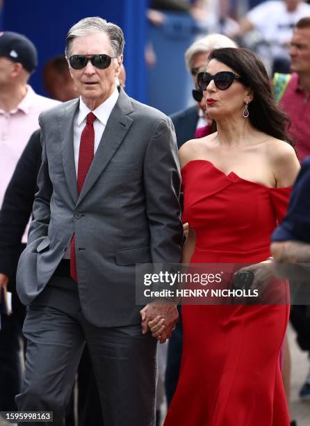 Liverpool's US owner John W. Henry and his wife Linda Pizzuti Henry arrive ahead of the English Premier League football match between Chelsea and...