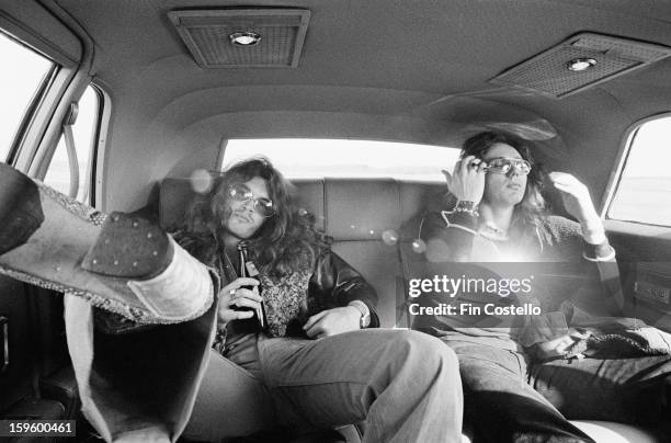 1st NOVEMBER: Bass player Glenn Hughes and singer David Coverdale from Deep Purple posed in the back of a limousine car during the band's American...